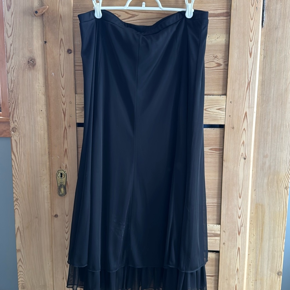 Formal Black skirt with ruffle on the bottom.